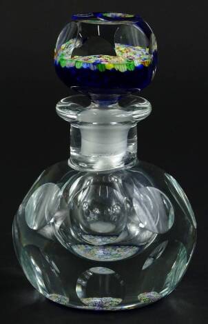 A Whitefriars faceted glass ink or scent bottle, the blue faceted stopper decorated with fine millefiori design, 15cm H.