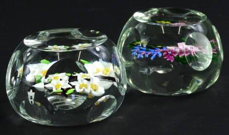 Two similar Whitefriars paperweights, each decorated with flowers and leaves, 7cm W.