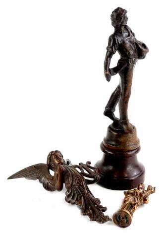 Various items of metalware, to include bronze angel carrying a caryatid (mount from piece of furniture), 24cm H, a bronzed figure of a Madonna and child, stamped N.D. de la Jarde Marseille and a spelter figure of a young man on a wooden base. (3)