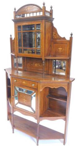 A late 19th/early 20thC rosewood and marquetry side cabinet, the raised back with a single glazed doors, with bevelled glass, enclosing a mirror, flanked by two canted recesses each on turned supports above a further mirror plate, the base with a frieze d