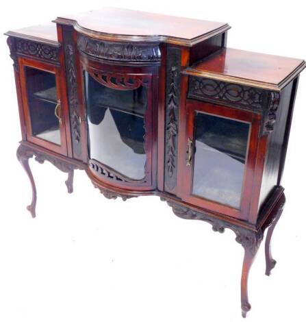 An Edwardian mahogany side cabinet, with a bow fronted glazed door, flanked by two further glazed doors on cabriole legs, 122cm W.