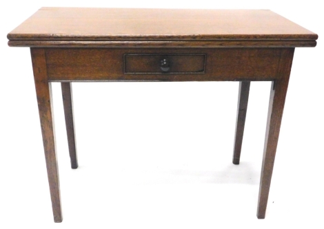 A 19thC oak tea table, the rectangular top enclosing polished surface above a small frieze drawer on square tapering legs, 93cm W.