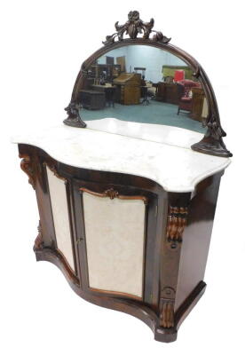 A Victorian rosewood side cabinet, the raised demi lune shaped back with a carved moulded frame, decorated with leaves and berries, the serpentine shaped base with a white marble top, above two doors inset with pale blue damask fabric on plinth base, 117c