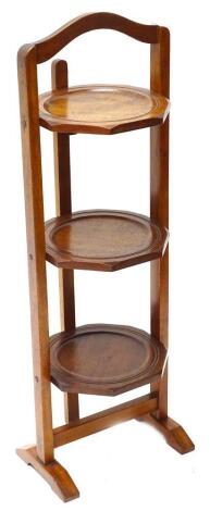 An early to mid 20thC mahogany three tier cake stand.
