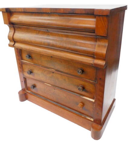 A Victorian figured mahogany chest of drawers, with an inverted breakfront top and an arrangement of five drawers, one with fitted interior, three with turned wood handles, on plinth base, lacking pillars, 123cm W.