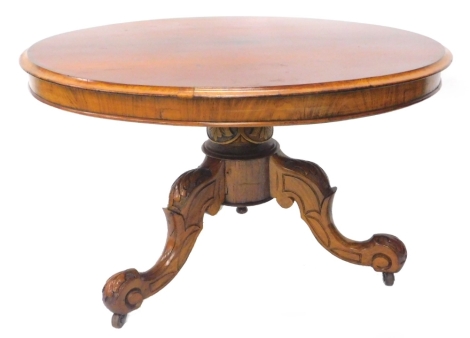 A mahogany coffee table, the circular top with a moulded edge on a short leaf carved column and splayed legs with ceramic castors, previously a Victorian breakfast table, but reduced in height, 89cm dia.