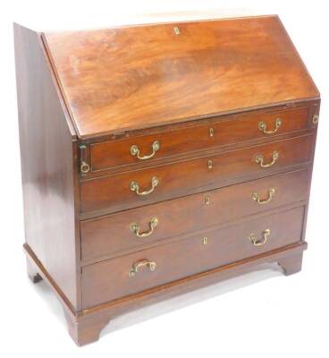 A George III mahogany bureau, the fall enclosing a fitted interior with later fret work panels, above four graduated drawers each with brass drop handles and bracket feet, 107cm W.