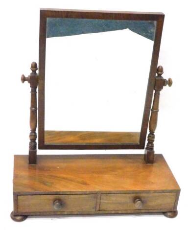 A Victorian mahogany dressing table mirror, the rectangular plate on turned supports, the base with two frieze drawers and bun feet, 57cm W.