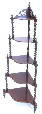 A Victorian mahogany corner what not, the top with a fret carved frieze on spirally turned supports with turned feet, 154cm H.