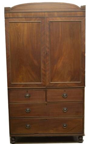 A Regency mahogany linen press, with ebony strung D-shape cornice, the two flame doors revealing press drawers, over two short and two long graduated drawers, with pressed oval brass loop handles, on turned feet, 204cm H, 123cm W, 53cm D.