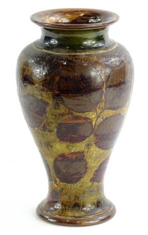 A Royal Doulton stoneware vase, decorated with a design of leaves etc., impressed marks to underside, 26cm H.