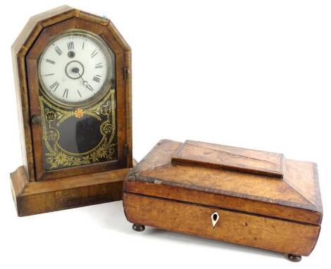 A 19thC bird's eye maple workbox, on bun feet (AF), 31cm W and an American mantel clock (2).