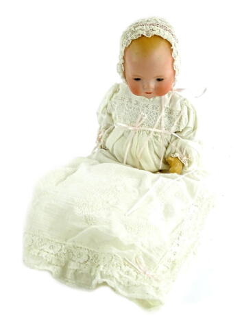 An Armand Marseille small bisque headed doll, with sleeping eyes, closed mouth, composition limbs etc., later dress, 33cm L.