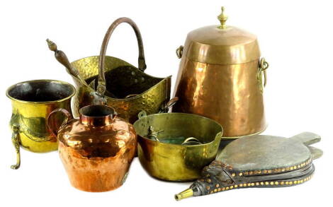 A collection of brass and copper, to include a large jug, a coal scuttle, shovel candlesticks etc.