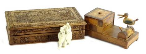 Miscellaneous items, to include a late 19thC/early 20thC Indian ivory carving of an elephant with howdah etc., a novelty cigarette box and a carved cigar box.