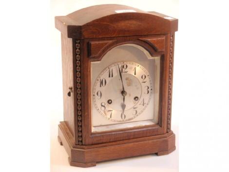 A 1930's oak mantel clock