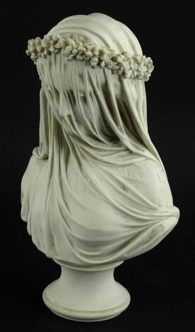 A marbleised resin bust, modelled in the form of a lady wearing head dress and a veil, bronzed plaque to underside stamped Made in England, (AF), 36cm H.