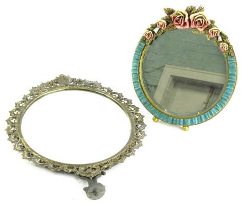 A mid 20thC gilt dressing mirror, with barbola type decoration of flowers and an oval brass shaving mirror.