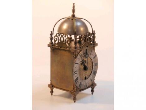 A brass framed lantern table clock