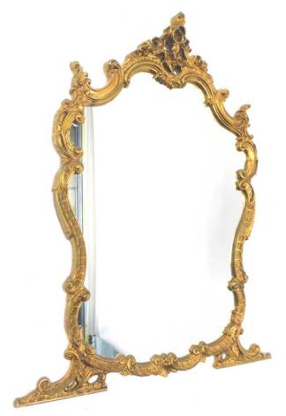 A gilt gesso cartouche shaped over mantel mirror, with rococo scrolls etc., 136cm x 86cm.