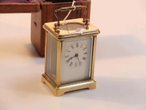 A gilt metal carriage clock