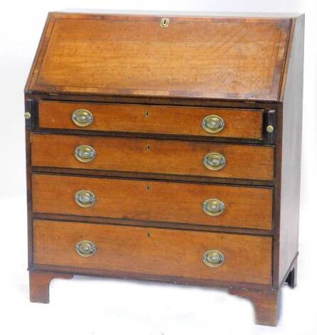 An early 19thC oak and mahogany cross banded bureau, the fall enclosing a fitted interior above four graduated drawers, each with oval brass handles on bracket feet, 96cm W.