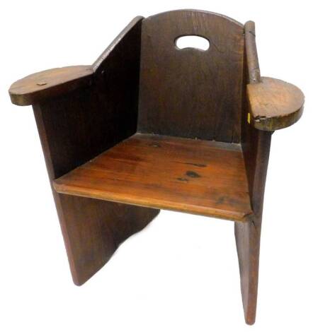 A country made oak chair, with a pierced back, shaped arms and tapering seat, 66cm W.