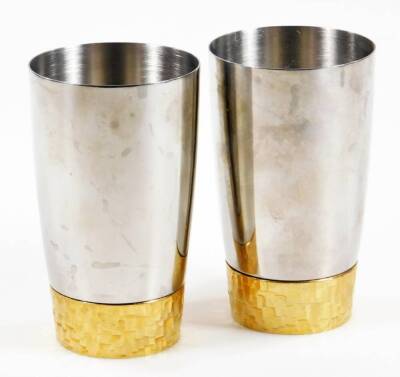 Stuart Devlin for Viners. Two beakers, 12cm H, orb flower holder, dish and two candlesticks, each in parcel gilt, marked beneath. (a quantity) - 2