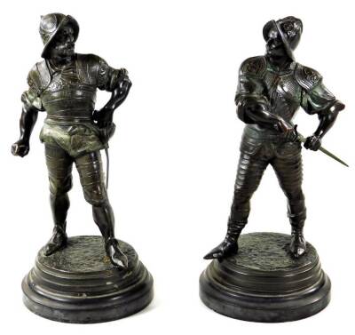 Jean Jules Salmson (1886-1940). Soldiers, a pair, one drawing sword the other in standing pose on circular bases, patinated bronze, signed, 34cm H. (2)