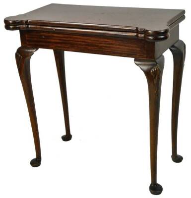 A George II style walnut card table, the shaped folding top with a baize lining, on shell capped cabriole legs terminating in club feet, when closed, 76cm H, 73cm W, 38cm D.