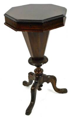 A Victorian walnut trumpet sewing box, the octagonal top with hinged lid and fitted interior, raised on a shaped stem terminating in carved cabriole legs, 76cm H, 43cm W, 43cm D.