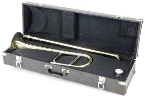 A Stagg 77-Taj brass two piece trombone, no. H0787D, with separate mouth piece, in fitted case, 73cm W.