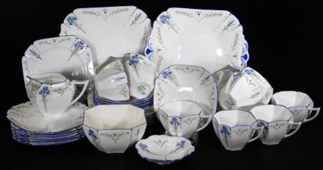 A Shelley Blue Iris pattern tea service, comprising two sandwich plates, 24cm W, sugar bowl, milk jug, cups, saucers and sandwich plates, no.19511, the milk jug registered 723404. (a quantity)