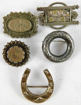 A small quantity of silver and silver plated jewellery, comprising four silver hinged bangles, two oval silver lockets, a silver plated heart locket, a silver horse shoe brooch, three florally engraved silver brooches, and a further silver plated florally - 3