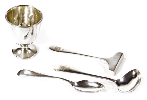 A harlequin Queen Elizabeth II silver Christening set, comprising egg cup, 6cm H, medicine spoon and pusher and teaspoon, Sheffield 1954 and 1955, some pieces engraved, 2½oz. (4)