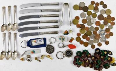 Various silver, etc, a set of seven George VI silver teaspoons and sugar bows, 11cm W, with shaped bright cut handles, Sheffield 1930, 3½oz, various butter knives, small quantity of coins, badges, etc. (a quantity)