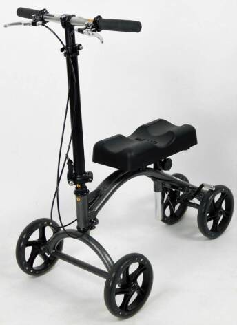 A Drive folding four wheel knee scooter, in black, grey and gold colourway, 91cm H.