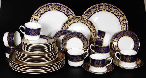 A Royal Worcester Sandringham pattern part dinner service, to include eight dinner plates, 26cm Dia. side plates, bread and butter plates, coffee cans, etc. printed marks beneath. (a quantity)