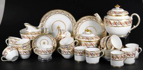 An early 19thC Coalport porcelain tea service, to include teapot, 19cm H, slop bowl, lidded sucrier, milk jug, plates, cups, saucers, coffee can, etc, each decorated with gilt flowers and entwined scrolls in orange, unmarked. (a quantity)