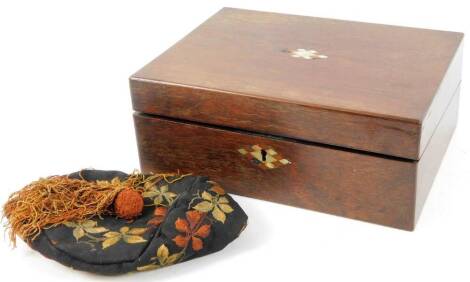 An early 20thC oak writing slope, of rectangular form with elaborate diamond escutcheon and a fitted interior, with one piece leather section, 12cvm H, 33cm W, 23cm D, and a smoking hat decorated with flowers. (2)