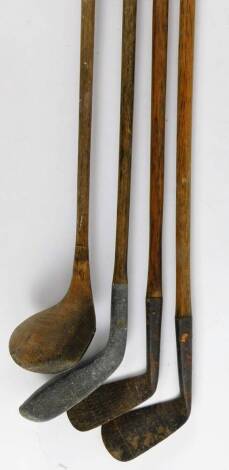 Various hickory shafted golf clubs, an iron indistinctly marked, wooden headed club, 112cm W, etc. (a quantity)