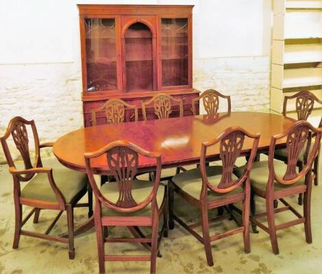 A yew wood finish dining suite, comprising of D end table, display cabinet and eight (6+2) shield back wheatsheaf dining chairs, each with drop in seats, on square tapering legs terminating in spade feet, the dining table with a wide crossbanding, when ex