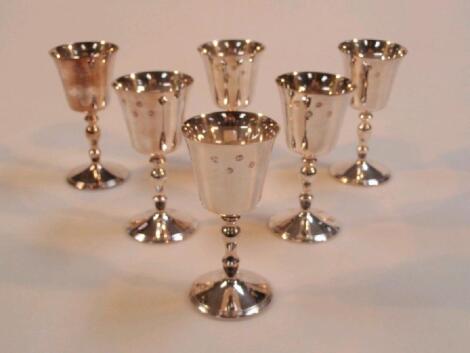 A set of six silver goblets with slightly everted bowls on baluster stems