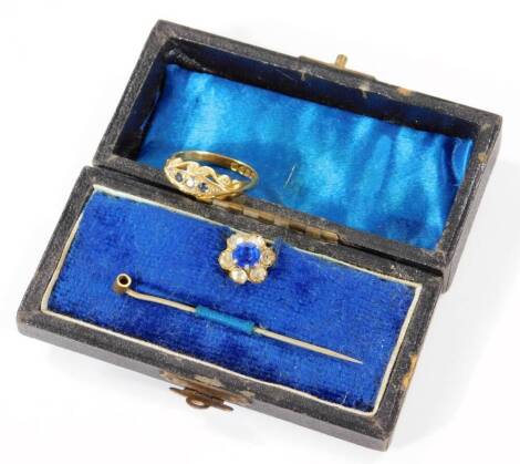 A ladies 18ct gold dress ring, set with blue and white stones on a part pierced shank, 3.3g all in, and a stick pin with removable head. (cased)