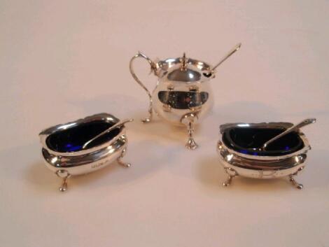 A pair of Edwardian silver salts of oval design on hoof feet