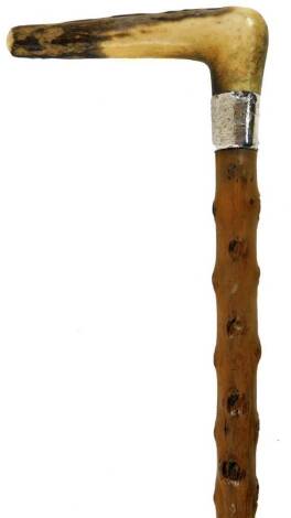 An antler handled walking stick, with silver collar and rubber end, the collar 1916, 81cm H.