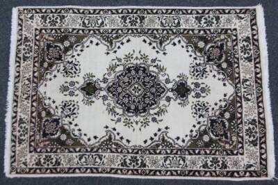 A Tabriz rug, in blue and cream, 138cm x 95cm.