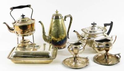 Various silver plated ware, three piece tea service to include teapot, 14cm H, with angular handle and knop, of cape form, pair of chamber sticks, lidded entree dish, spirit kettle on stand, etc. (a quantity)