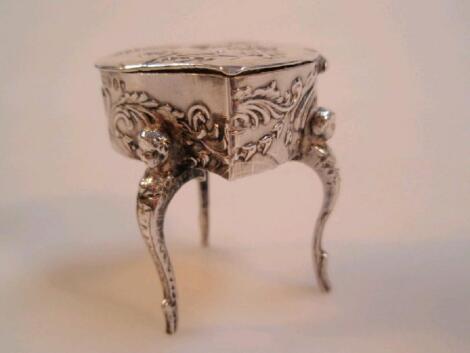 A small late Victorian silver heart shaped casket embossed with figures