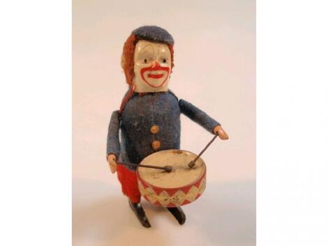 A Schuco clockwork drumming clown figure